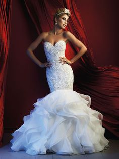 a woman in a wedding dress posing for the camera