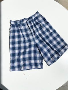 A pair of vintage plaid shorts in blue flannel. High waisted fit with a smocked waistline in back for easy and comfortable fit and a cuff at bottom with button and zipper closure. In great vintage condition with no rips tears or stains. Fabric rayon and linen. Waist26 rise 14 inseam 8 Cream Wool Coat, Physical Manifestation, 90s Flannel, Flannel Shorts, Blue Flannel, Plaid Pajamas, Fashion Wishlist, Vintage Plaid, Small Photos