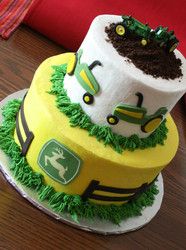 two tiered cake made to look like tractors