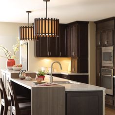 a kitchen with wooden cabinets and an island