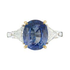 Sapphire and diamond engagement ring. 4.50ct oval AGL certified center cornflower sapphire, accented with tow trilliant cut side diamonds in a three-stone 18k yellow and white gold setting. AGL certified natural simple heat only. 1 medium cornflower blue Sapphire 10.66 x 8.79 x 5.47mm, approx. total weight 4.50cts AGL certificate # GB109547 2 trilliant cut diamonds approx. total weight.72cts, E-F, VS1 Size 6.5 and sizable Natural simple heat only, no enhancements Width at top: 10.7mm Width at bo Cornflower Sapphire, Cornflower Blue Sapphire, Sapphire And Diamond Engagement Ring, Trilogy Engagement Ring, Sapphire Diamond Engagement, Contemporary Engagement Rings, Platinum Diamond Engagement Rings, Blue Sapphire Diamond, Round Diamond Engagement Rings