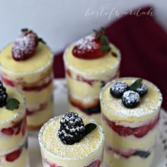 small desserts are arranged on a white plate