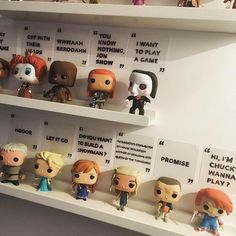 the shelves are filled with many different pop - up action figures, including figurines