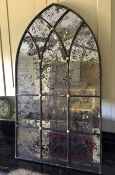 an old stained glass window on the wall