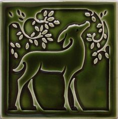 a green tile with an animal on it