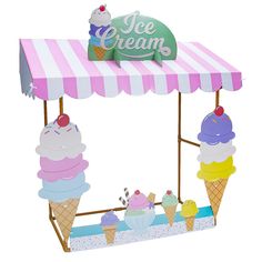 an ice cream stand with three scoops of ice cream on top and two cones in the middle