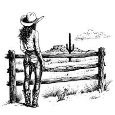 a woman standing in front of a fence looking at the desert