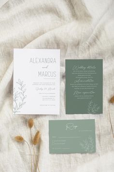 the wedding stationery is laid out on a bed