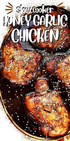 some chicken is cooking in a pan with sesame seeds on the side and text overlay that reads slow cooker honey garlic chicken