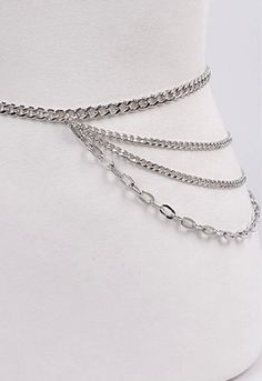 Layered Chain Belt This eye-catching layered chain belt will elevate the simplest outfits. Available in gold and silver. Featuring a chunky curved chain paired with three smaller chains that drapes across your hips. Pairs perfectly with an oversized poplin shirt or your little black dress. Multi layered chains. Width 0.4" Length 44.75" 70% PU 30% Elastic. One size fit most. Gold/Silver metal. Lobster clasp closure. Oversized Poplin Shirt, Layered Chain, Layered Chains, The Chain, Chain Belt, Poplin Shirt, Gold And Silver, Multi Layering, Simple Outfits