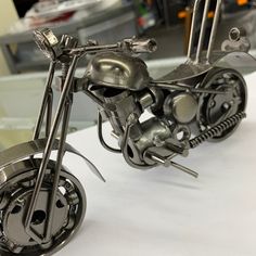 a metal model of a motorcycle on display