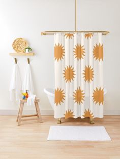 an orange shower curtain with blue flowers on it