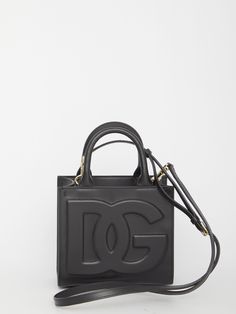 DG Daily mini tote bag in black calfskin with tonal embossed DG logo on the front. It features fixed double handles, adjustable and detachable shoulder strap, one main interior compartment, one interior zip pocket and one interior slip pocket.Dimensions: 17,5x16,5x9cm Size nationality: UNI Product number: 31448683 Product code: BB7479AW57680999 Composition: 100% calfskin Luxury Logo Tote Shoulder Bag, High-end Rectangular Shoulder Bag With Logo, High-end Leather Shoulder Bag With Logo, Designer Calf Leather Shoulder Bag With Logo, Luxury Rectangular Shoulder Bag With Logo, Formal Double Handle Shoulder Bag With Logo, Designer Rectangular Satchel With Logo, Designer Top Handle Satchel With Logo, Luxury Crossbody Shoulder Bag With Logo