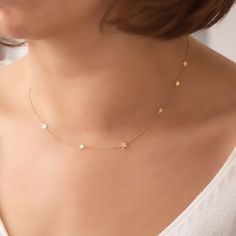 14k 18k Solid Gold 8 Mini Star Necklace, Random Spaced Dainty Star Necklace, Star Station Yellow White or Rose Gold Necklace is Gift For Her Material: Solid Gold, real gold (not gold-filled or no gold plated) Karat: 14 Karat Gold (585), 18 Karat Gold (750) 8 Stars are spaced randomly to the chain. There are 2-star sizes on the chain and they are randomly fixed. Bigger size is 6 mm whereas the smaller size is 5 mm Chain Length - 14 inches Chain Length - 15 inches adjustable 14 inches (choker) Chain Length - 16 inches adjustable 15 inches (choker) Chain Length - 17 inches adjustable 15 inches Chain Length - 18 inches adjustable 16 inches Chain Length - 20 inches adjustable 18 inches Chain Length - 22 inches adjustable 20 inches We put an additional adjustment ring on the necklace to use it s Delicate Yellow Gold Star Necklace, Delicate 14k Gold Star Necklace, Delicate Star-shaped Yellow Gold Necklace, Star-shaped Necklace For Anniversary, Necklace Star, Choker Chain, Urn Necklaces, Bird Necklace, Infinity Necklace