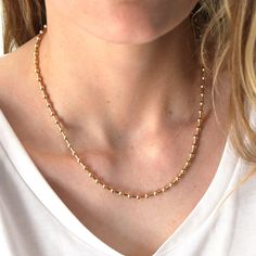 "This beaded silver or gold chain necklace, perfect for layering or a minimalist look. D E T A I L S *Beaded by hand with 4mm beads  *Choose 14kt gold filled, sterling silver or mixed (silver beads and gold accents)  LENGTH  - Please select from the drop down selection. - The standard length is normally 18\". - Model is wearing 18\" in Photos. -Shown with our herringbone and aquamarine necklaces for styling inspiration. HOW TO PERSONALIZE *Select your choices from the drop down menu to create yo Minimalist Beaded Clavicle Chain Necklace For Everyday, Gold Beaded Chain Necklace For Everyday, Everyday Gold Beaded Chain Necklace, Everyday Gold Ball Chain Necklace, Gold Chain Necklace With Round Beads For Everyday, Dainty Gold Beaded Necklaces For Everyday, Dainty Gold Beaded Necklace For Everyday, Minimalist Ball Chain Necklace For Layering, Dainty Ball Chain Necklace For Everyday