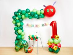 the very hungry caterpillar balloon arch is ready to be used as a birthday decoration