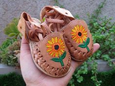 Beautiful Sunflower lace up baby and toddlers huarache sandalWe also have the lace up sunflower for adult you can create a mommy and baby matching outfit!!If you want to make sure they'll fit, please measure your baby foot from toe to heel.Use the following chart to choose the correct size.Size 5 walker  measure 12 cmSize 6 walker measure 13cmSize 7 walker measure 14cmSize 8 toddler measure 15cmSize 9  toddler measure 16cmSize 10 toddler measure 17cmSize 11  toddler measure 18cmSize 12  toddler Handmade Adjustable Huarache Sandals For Spring, Adjustable Huarache Sandals For Spring Festival, Spring Festival Adjustable Huarache Sandals, Traditional Adjustable Huarache Sandals For Spring, Adjustable Soft Sole Huarache Sandals For Spring, Adjustable Soft Sole Huaraches For Spring, Handmade Casual Huarache Sandals For Spring, Casual Handmade Huarache Sandals For Spring, Spring Huaraches With Soft Sole And Round Toe