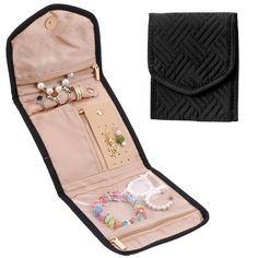 an open black case with jewelry and bracelets in it, next to a white background