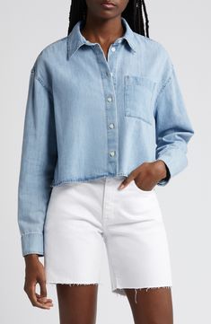 Every closet craves this polished chambray shirt updated in a boxy cropped silhouette. 20" length (size Medium) Front button closure Spread collar Long sleeves with two-button cuffs Chest patch pocket 100% cotton Machine wash, tumble dry Imported Cropped Cotton Denim Top With Button Closure, Trendy Cropped Shirt For Spring, Cropped Denim Top For Workwear, Casual Cropped Shirt For Work, Spring Relaxed Fit Cropped Shirt, Everyday Cropped Spring Shirt, Casual Relaxed Fit Cropped Shirt, Cropped Spring Shirt For Everyday, Cropped Cotton Denim Top For Fall