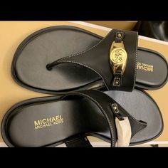 New Leather Michael Kors Sandals Luxury Black Leather Flip Flops, Designer Leather Flip Flops For The Beach, Designer Leather Flip Flops For Beach, Elegant Adjustable Black Flip Flops, Designer Black Leather Flip Flops, Elegant Black Flip Flops With Single Toe Strap, Designer Black Toe Post Sandals, Luxury Black T-strap Sandals With Single Toe Strap, Luxury Black Open Toe T-strap Sandals