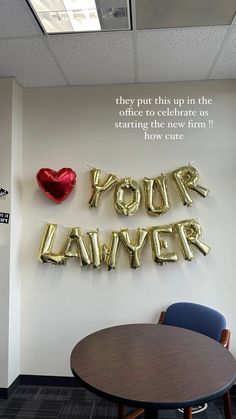 an office decorated with balloons that say your lawer and then put the letters on the wall