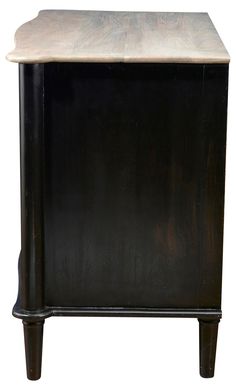 a black cabinet with a marble top and legs on the bottom, against a white background