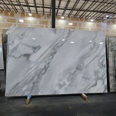 a large white marble slab in a warehouse