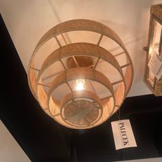 a light fixture hanging from the ceiling in a room