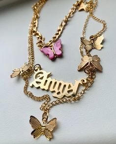 Stunning gold 'Angel' necklace with gold butterflies and a pink butterfly 🦋 💕 Check my shop out for more cute jewellery 😊 Gold Metal Butterfly Necklace For Party, Cute Butterfly-shaped Jewelry For Parties, Trendy Butterfly-shaped Jewelry With Adjustable Chain, Trendy Butterfly Shaped Jewelry With Adjustable Chain, Pink Clavicle Chain Charm Necklace For Party, Gold Butterfly Necklace For Party, Gold Butterfly Necklace With Delicate Chain For Party, Trendy Pink Gold Plated Jewelry, Trendy Pink Gold-plated Jewelry