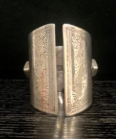 Early 19th Century Bedouin Silver Cuff, Hallmarked IB Bedouin cuff bracelet  This kind of heavy bracelet is worn by the Bedouin tribes of North Africa and the Arabian Peninsula. This is a very rare example of the work of John Bettridge, an early 19th-century silversmith from Birmingham.  John Bettridge was a highly prized silversmith who specialised mainly in small silver boxes and vinaigrettes. His marks are seen for 1817 - 1834 and he was a maker of caddy spoons, decanter labels, flatware and Ceremonial Antique Silver Cuff Bangle, Handmade Antique Silver Cuff Bracelet For Ceremonial Occasions, Handmade Antique Silver Cuff Bracelet For Ceremonial, Traditional Engraved Wide Band Jewelry, Collectible Engraved Cuff Bangle, Traditional Wide Band Engraved Jewelry, Unique Antique Silver Ceremonial Bracelet, Traditional Engraved Collectible Bangle, Unique Antique Silver Ceremonial Bracelets