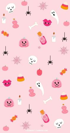 a pink background with halloween themed items on it