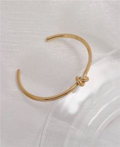 Minimalist Gold Knot Cuff Bracelet, Gold Cuff Bracelet, Gold Tie Knot Bracelet, Gold Minimalist Cuff, Gold Minimalist Bracelet, Gold Stacking Bracelet, Bridesmaid Bracelet, Bridesmaid Jewelry, Bridesmaid Gift, Ready to Ship, Tie the Knot Gift✦ 18k gold plated no tarnish water proof ✦ Size: Approximately 2.25 inches inner diameter ✦ Inner Circumference (wrist): ~6.5" inner circumference ✦ 3mm thick Knot Bracelet Gold, Cuff Bracelet Gold, Gold Cuff Bracelet, Gold Tie, Jewelry Bridesmaid, Knot Bracelet, Gold Bracelet Cuff, Tie The Knot, Bridesmaid Bracelet