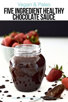 chocolate sauce in a jar with strawberries on the side and text vegan & paleo five ingredient healthy chocolate sauce