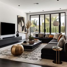 a modern living room with large windows and black couches in front of a flat screen tv