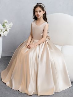 Fabric: Satin; Silhouette: A-Line/Princess; Neckline: Crew Neck; Hemline/Train: Floor-Length; Embellishment: Bowknot Sleeve: Sleeveless; Waist: Natural; Back Style: Zipper; Built-In Bra: No; Shown Color: Dusty Rose Special; Season: Spring;Summer;Fall;Winter; Satin Flower Girl Dresses, Flower Girl Dresses Champagne, Party Gown Dress, Satin Flower Girl Dress, Badgley Mischka Dress, First Communion Dresses, Party Dresses Online, Communion Dresses, Color Champagne