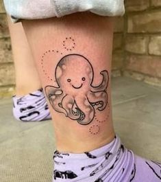 an octopus tattoo on the ankle