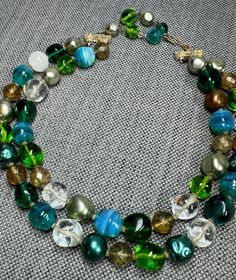 Vintage Double Strand Multi Colored Sea Green, Turquoise, Opalescent, Faceted & Mixed Bead Necklace, Internal Bubbles, Hook Clasp, c. 1950s . Gorgeous mix of sea green bubble glass beads, clear, faceted, turquoise opalescent swirl, and more.  Double strand with hook clasp.  Measures 12" + 3" extension for a total of 15".  Second strand has ~3" drop.  In good vintage condition showing no visible damage.  Please see additional listings for more vintage jewelry at great prices! Luxury Vintage Beaded Necklaces With Colorful Beads, Luxury Vintage Double Strand Jewelry, Vintage Blue Double Strand Necklaces, Vintage Turquoise Single Strand Necklace, Vintage Turquoise Jewelry With Colorful Beads, Vintage Multi-strand Beads, Vintage Adjustable Turquoise Beaded Necklace, Vintage Adjustable Turquoise Beaded Necklaces, Adjustable Vintage Turquoise Beaded Necklace