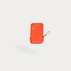 A compact carrier for your AirPods, this pebble leather clip-on pouch with microfiber interior attaches to your Bandolier Phone case, keys or everyday bag to ensure your AirPods are always within reach. Functional Rectangular Coin Purse, Functional Rectangular Pouch With Interior Key Chain Holder, Rectangular Bag With Key Clip For Daily Use, Rectangular Travel Pouch With Key Clip, Modern Coin Purse With Key Clip For Daily Use, Modern Coin Purse With Key Clip For Travel, Versatile Everyday Bag With Key Leash, Modern Leather Phone Accessories For Everyday Use, Modern Travel Coin Purse With Key Clip