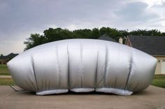 an inflatable object sitting on top of a driveway