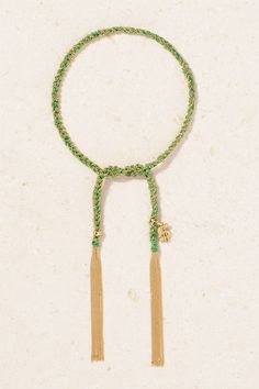 Carolina Bucci's 'Lucky' collection is inspired by the bracelets she used to exchange with friends on the beach as a child. Part of the range, this 'Money' style has been crafted in the brand's Italian workshop from 18-karat gold and hand-braided with green silk. It's strung with a charm shaped to depict a dollar sign. Elegant Green Jewelry For The Beach, Elegant Green Jewelry For Beach, Elegant Green Beach Jewelry, Handmade Yellow Gold Friendship Bracelet, Luxury Yellow Gold Braided Bracelet As A Gift, Luxury Adjustable Flexible Bracelets, Luxury Flexible Adjustable Bracelets, Handmade Adjustable Yellow Gold Bracelet, Luxury Jewelry Gift