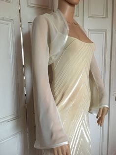 This is a beautiful hand made ivory chiffon shrug with long FLARED sleeves ideal for weddings or special occasions. It can also be worn with casual wear. It has a silver edging. It can be made in any size from 8 to 24 (UK sizes). It is made in the UK. It is normally sent out to you within 5 days, but I am very happy to make your order a priority if you need it urgently. Just let me know the date needed by. Postage is free in the UK! International postage is £9. I am happy to exchange items or re Satin Dress With Jacket, Chiffon Shrug, Chiffon Bolero, Shrug Jacket, Sleeve Bolero, Long Sleeve Shrug, Chiffon Jacket, Lace Shrug, Shrug For Dresses