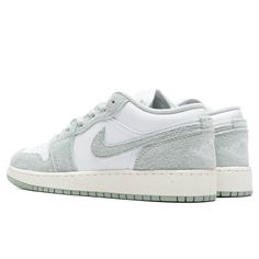 The Air Jordan 1 Low is a signature footwear style and is constructed with a premium leather upper, the silhouette is met with classic Nike motifs including the Swoosh stitched upon the side panels and branding embroidered on the heel. A pull-tab contributes to its easy application while Nike's Air technology is added within the midsole for a responsive experience with each step. Leather and synthetic upper Cotton lace closure Air-Sole unit Rubber outsole Stitched motifs Embroidered branding Grade school sizing Style no: FN9137-131 Green Custom Sneakers With Textured Sole For Streetwear, White Jordan Shoes With Speckled Midsole, White Sole Jordan Shoes With Speckled Midsole, Leather Jordan Shoes With Speckled Midsole, Leather Jordan Shoes With White And Gum Sole, Casual Jordan Shoes With Speckled Midsole, Jordan 100, Air Jordan 1 Low, Kids Jordans