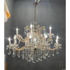 a chandelier hanging from the ceiling in a room