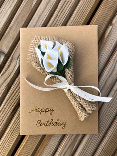 a birthday card with flowers on it