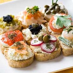 a white plate topped with different types of appetizers