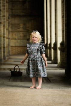 This vintage inspired Liberty of London Print dress will make the most charming flower girl dress or Junior Bridesmaid.  Each dress is handmade to order, using traditional tailoring techniques and attention to detail. Shown here in Liberty Willliam Morris Strawberry Thief Greybut can be made bespoke in any of our Liberty Prints - Please add in the message box your choice for fabric -Cuffed puffed sleeves -Bodice with princess seams -Ruffle extending from the front waist to the back. -Skirt gathe Ruffled Princess Dress For Garden Party, Whimsical Floral Print Dress With Short Sleeves, Princess Style Ruffled Dresses For Garden Party, Princess Style Dress With Ruffles For Garden Party, Toddler Dresses Fancy, Baby Special Occasion Dress, Dress Pins, Girls Couture Dresses, Gray Flower Girl