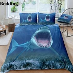 a shark with its mouth open in the ocean on a bedding set that has been designed to look like an underwater scene