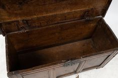 an old wooden chest with two doors open