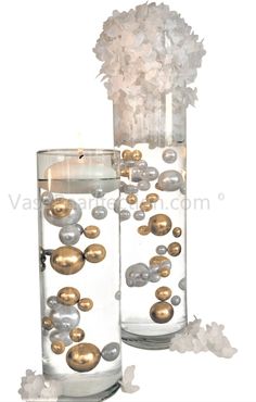 two clear vases with gold and silver balls in them, one filled with water