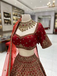 Elevate your wedding look with our Maroon Bridal Lehenga BL-104. This luxurious piece combines maroon and intricate gold embroidery, evoking a sense of regal beauty. The high-quality fabric and handcrafted details make for a truly exquisite and timeless ensemble. Make a statement on your special day with our Lehenga. F Maroon Lehenga Combinations, Maroon Bridal Lehenga, Maroon Lehenga, Wedding Look, Exclusive Dress, Gold Embroidery, Bridal Lehenga, Wedding Looks, Wedding Outfit